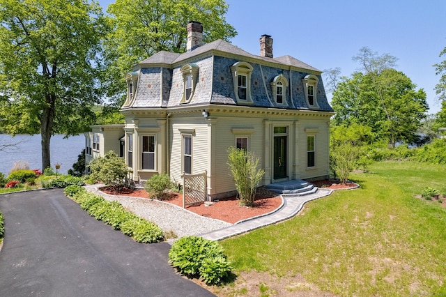 77 Main St, East Haddam, CT 06423 - victorian home featuring mansard roof, a chimney, a front lawn, and a high end roof