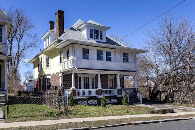 67-69 Sterling St, Hartford, CT 06154 - traditional style home featuring covered porch, a front yard, fence, brick siding, and a chimney