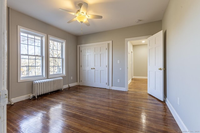67-69 Sterling St, Hartford, CT 06154 - unfurnished bedroom with radiator heating unit, baseboards, and dark wood-style floors