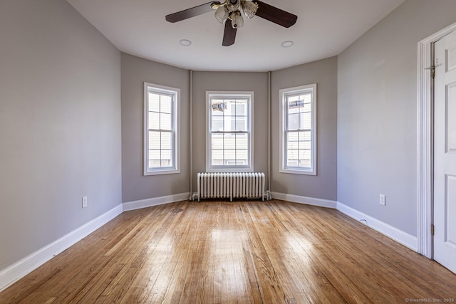 67-69 Sterling St, Hartford, CT 06154 - unfurnished room with radiator heating unit, a ceiling fan, hardwood / wood-style floors, and baseboards