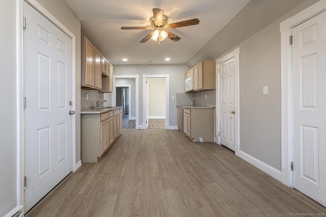 67-69 Sterling St, Hartford, CT 06154 - kitchen with ceiling fan, light wood finished floors, white microwave, and baseboards