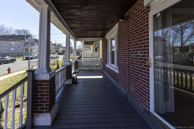 67-69 Sterling St, Hartford, CT 06154 - wooden terrace featuring covered porch and a residential view