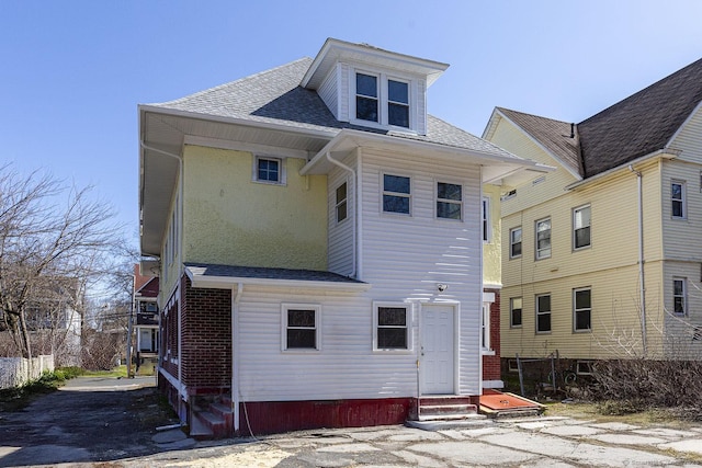 67-69 Sterling St, Hartford, CT 06154 - rear view of property with entry steps and a shingled roof