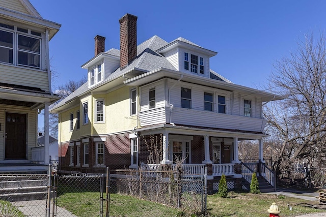 67-69 Sterling St, Hartford, CT 06154 - american foursquare style home with covered porch, a chimney, a fenced front yard, brick siding, and a gate