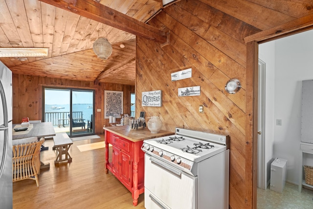 0 Burr Is, Branford, CT 06405 - kitchen with wood ceiling, light wood-style floors, wooden walls, white range with gas cooktop, and vaulted ceiling with beams