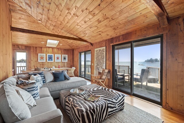 0 Burr Is, Branford, CT 06405 - living room with wood finished floors, wooden walls, and a wealth of natural light