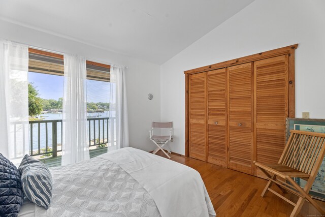 0 Burr Is, Branford, CT 06405 - bedroom with lofted ceiling, a water view, access to outside, a closet, and wood finished floors