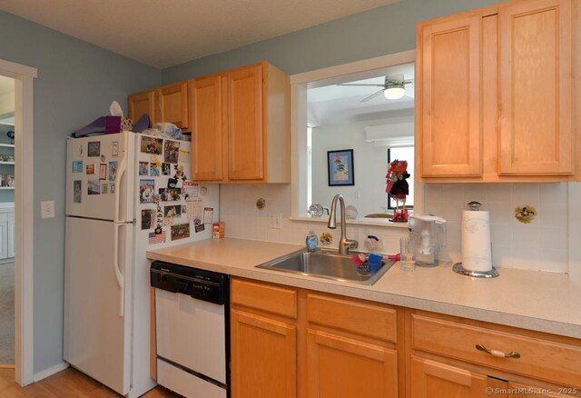 894 Heritage Vlg Unit B, Southbury, CT 06488 - kitchen with tasteful backsplash, white appliances, light countertops, and a sink