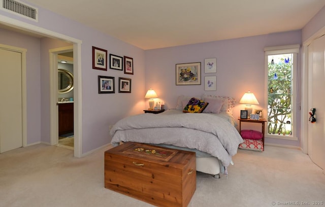894 Heritage Vlg Unit B, Southbury, CT 06488 - bedroom featuring visible vents, baseboards, ensuite bathroom, and light colored carpet