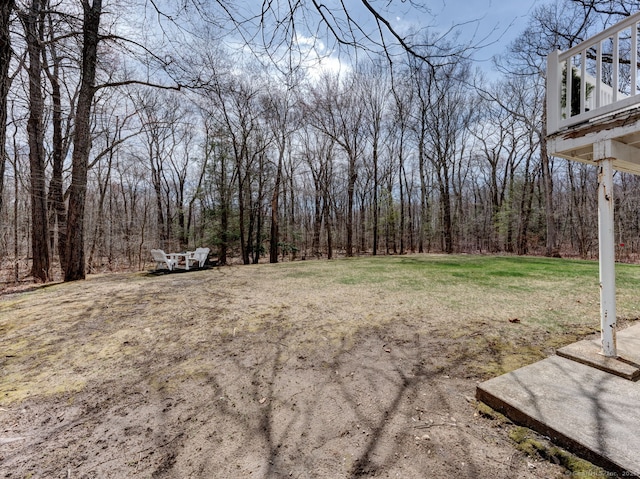 view of yard with a forest view