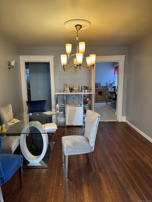 14 Grandview Ave, Waterbury, CT 06708 - dining space with baseboards, a notable chandelier, and wood finished floors