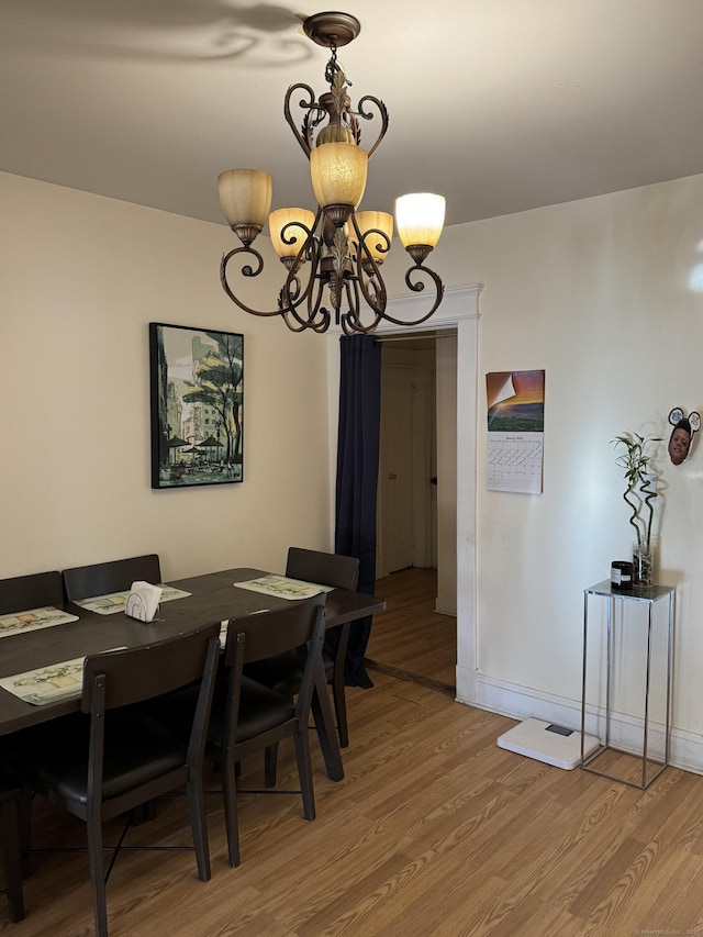 14 Grandview Ave, Waterbury, CT 06708 - dining space with baseboards, light wood-style floors, and an inviting chandelier