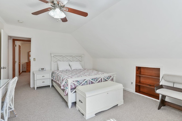 bedroom featuring light colored carpet, ceiling fan, and vaulted ceiling
