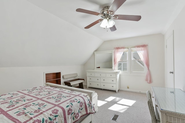 bedroom featuring light carpet, visible vents, baseboards, lofted ceiling, and a ceiling fan