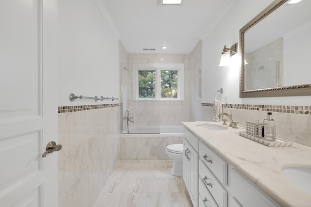 bathroom with double vanity, marble finish floor, a sink, and ornamental molding