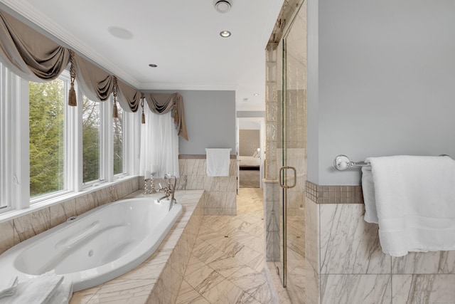 bathroom with crown molding, a stall shower, and a garden tub