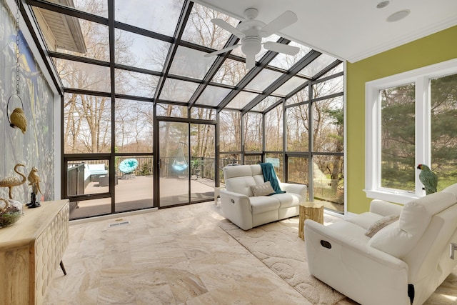 sunroom featuring visible vents, an outdoor living space, and a ceiling fan