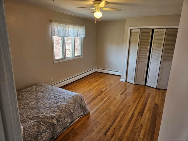 230 Old Field Rd, Southbury, CT 06488 - bedroom with ceiling fan, wood finished floors, a closet, and a baseboard radiator
