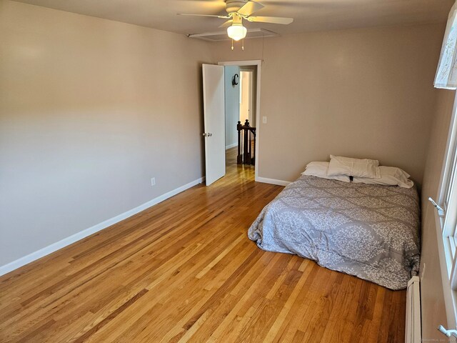 230 Old Field Rd, Southbury, CT 06488 - bedroom with light wood-type flooring, ceiling fan, baseboards, and a baseboard radiator