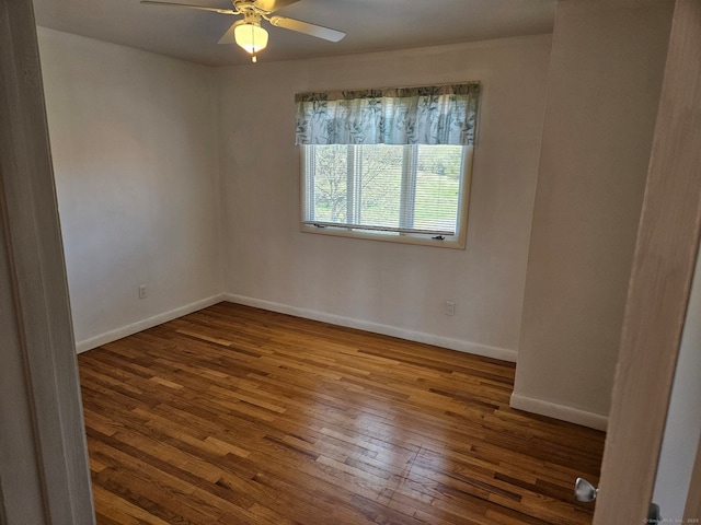 unfurnished room with hardwood / wood-style flooring, ceiling fan, and baseboards