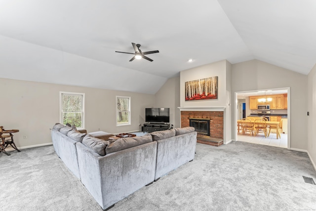 living room featuring visible vents, ceiling fan, light colored carpet, and lofted ceiling