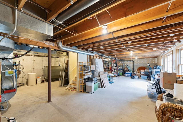 basement featuring heating unit and heating fuel