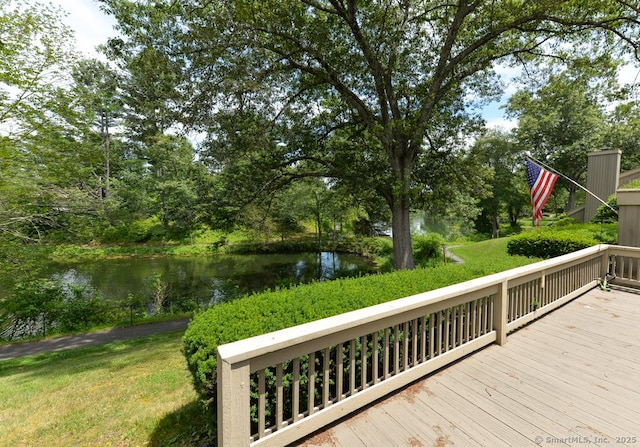 16 Heritage Vlg Unit A, Southbury, CT 06488 - deck featuring a water view and a lawn