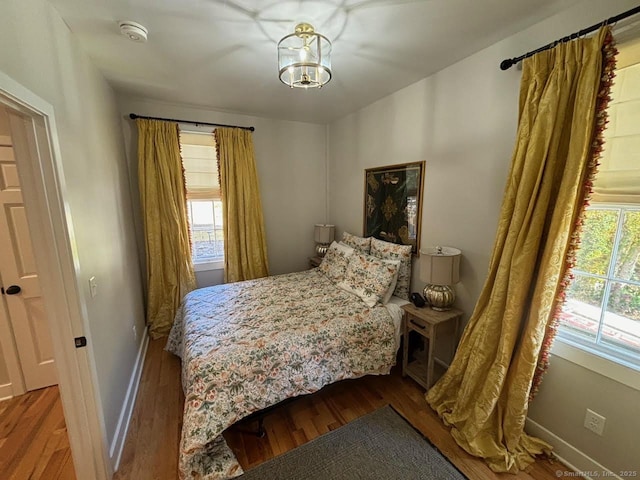 23 Main St, East Haddam, CT 06423 - bedroom featuring wood finished floors and a chandelier
