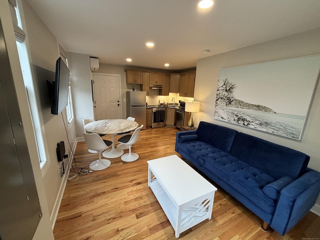 23 Main St, East Haddam, CT 06423 - living area with light wood-type flooring, recessed lighting, and an AC wall unit