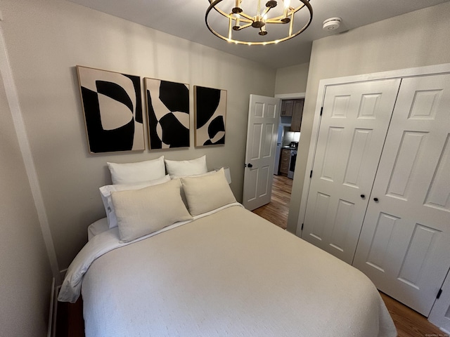 23 Main St, East Haddam, CT 06423 - bedroom with dark wood-type flooring, a chandelier, and a closet