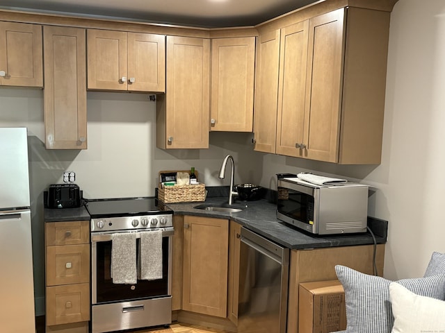 23 Main St, East Haddam, CT 06423 - kitchen with stainless steel appliances, dark countertops, and light wood-style flooring
