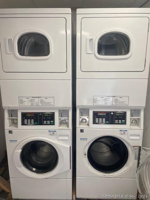shared laundry area featuring stacked washer and dryer and independent washer and dryer