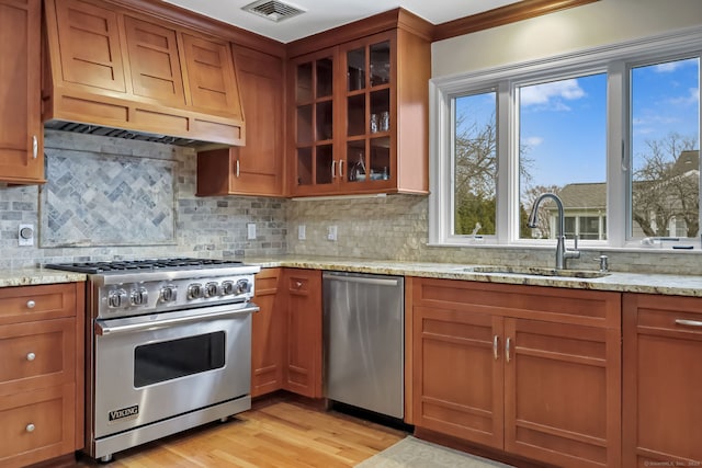 9 Pine Hill Avenue Ext, Norwalk, CT 06855 - kitchen with visible vents, custom exhaust hood, a sink, stainless steel appliances, and brown cabinets