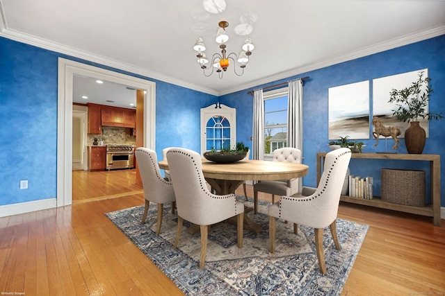 9 Pine Hill Avenue Ext, Norwalk, CT 06855 - dining space with light wood finished floors, crown molding, an inviting chandelier, and baseboards