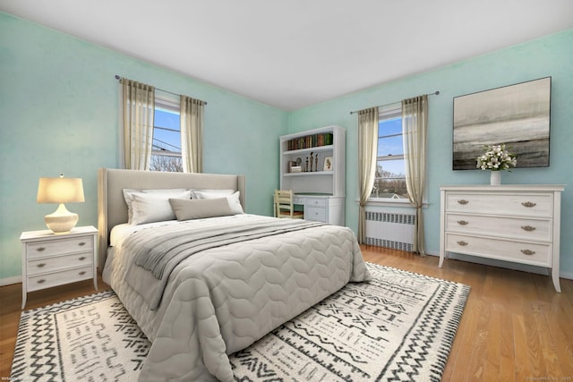 9 Pine Hill Avenue Ext, Norwalk, CT 06855 - bedroom featuring radiator, wood finished floors, baseboards, and multiple windows