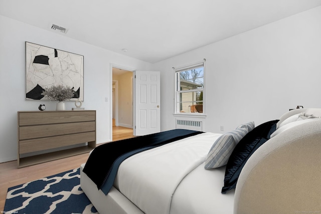 9 Pine Hill Avenue Ext, Norwalk, CT 06855 - bedroom featuring visible vents, radiator heating unit, and light wood finished floors