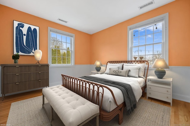 9 Pine Hill Avenue Ext, Norwalk, CT 06855 - bedroom with wood finished floors, multiple windows, and visible vents