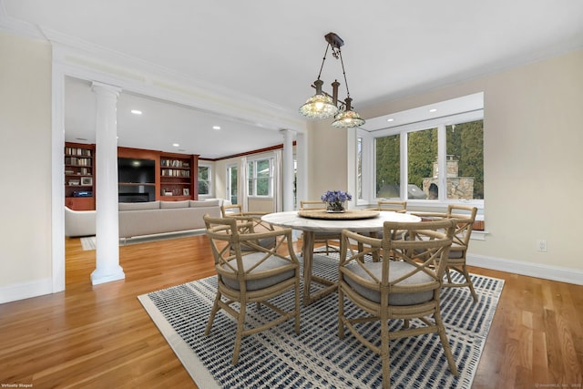 9 Pine Hill Avenue Ext, Norwalk, CT 06855 - dining room featuring ornamental molding, light wood-type flooring, decorative columns, and baseboards