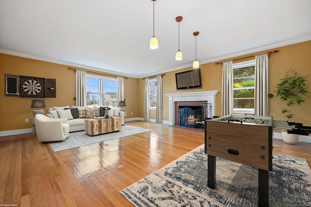 9 Pine Hill Avenue Ext, Norwalk, CT 06855 - living area featuring crown molding, light wood-style flooring, and a wealth of natural light