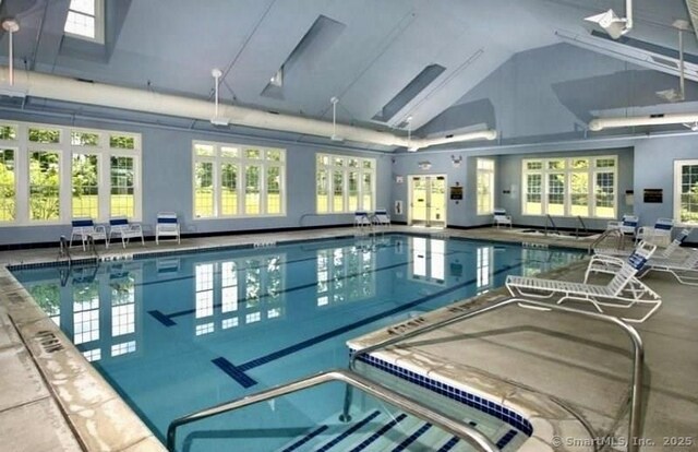 community pool featuring french doors