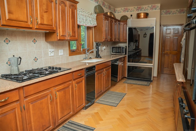 78 Limewood Ave, Branford, CT 06405 - kitchen with black appliances, a sink, brown cabinets, and backsplash