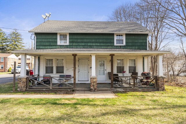 123 Fowler Avenue Ext, Meriden, CT 06451 - view of front of house featuring a porch, a front lawn, and a shingled roof