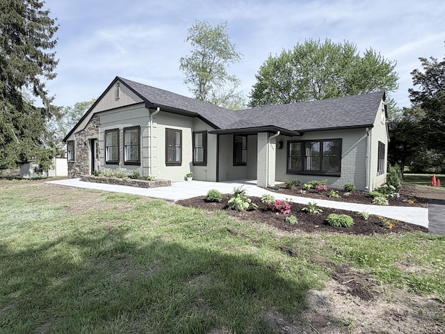 220 W Rd, Colchester, CT 06415 - view of front of house with brick siding, a front yard, and roof with shingles