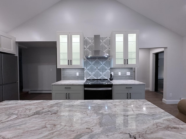 220 W Rd, Colchester, CT 06415 - kitchen with wall chimney exhaust hood, electric range, freestanding refrigerator, high vaulted ceiling, and light stone countertops
