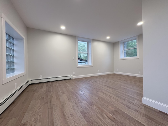 220 W Rd, Colchester, CT 06415 - empty room featuring wood finished floors, recessed lighting, baseboards, and baseboard heating