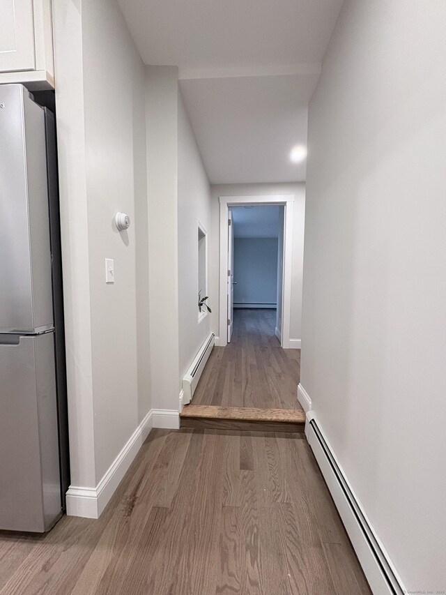 220 W Rd, Colchester, CT 06415 - hall featuring baseboard heating, wood finished floors, and baseboards