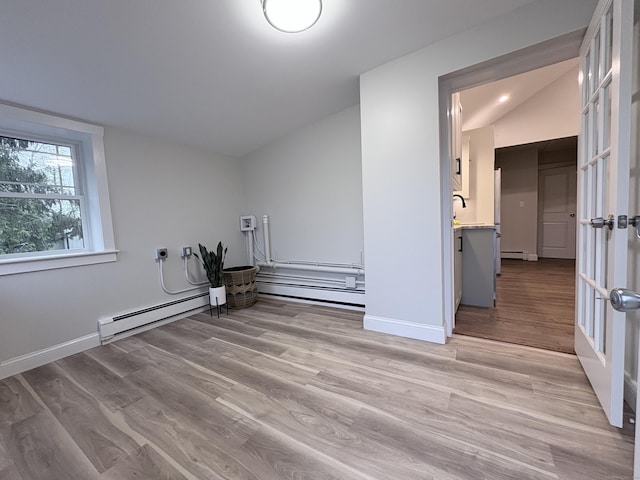 220 W Rd, Colchester, CT 06415 - spare room with a baseboard heating unit, light wood finished floors, and baseboards