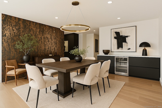 32 Pine Hill Ave, Norwalk, CT 06855 - dining room featuring wine cooler, recessed lighting, an accent wall, and light wood-style floors