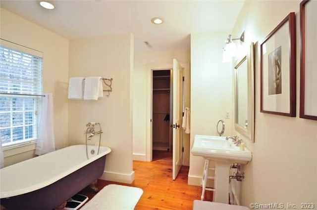 33 Sentry Hill Rd, Roxbury, CT 06783 - full bath featuring a soaking tub, wood finished floors, and recessed lighting