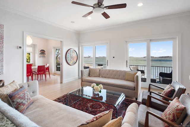 38 Yarmouth Rd, Norwalk, CT 06853 - living room with wood finished floors, ornamental molding, a ceiling fan, recessed lighting, and a water view